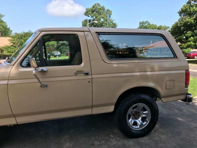 1990 pale brown (nude pantyhose) Ford Bronco Convertible