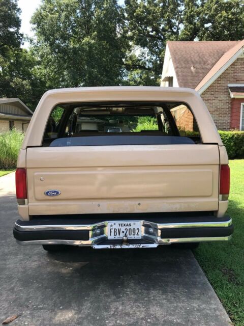1990 pale brown (nude pantyhose) Ford Bronco Convertible
