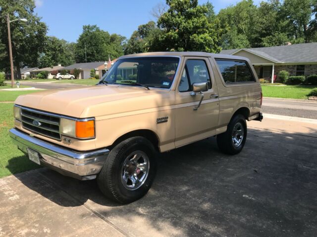 1990 pale brown (nude pantyhose) Ford Bronco Convertible