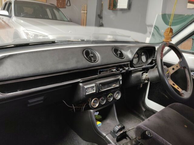 1972 white Ford Escort coupe