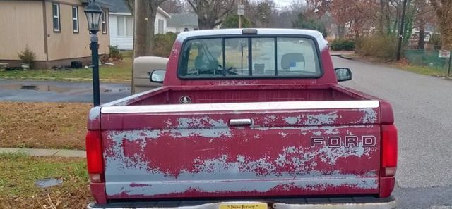 1993 Red Ford F-150 Standard Cab Pickup