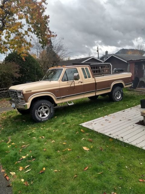 1986 two tone light and dark brown Ford F-250 Extended Cab Pickup