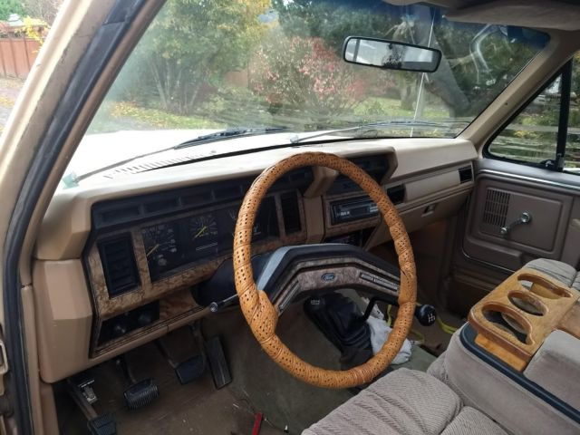 1986 two tone light and dark brown Ford F-250 Extended Cab Pickup