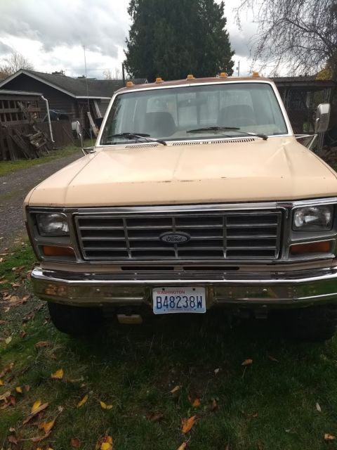 1986 two tone light and dark brown Ford F-250 Extended Cab Pickup