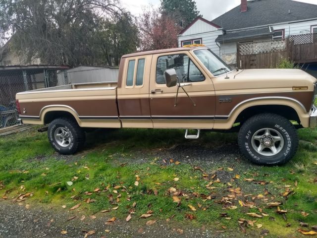 1986 two tone light and dark brown Ford F-250 Extended Cab Pickup