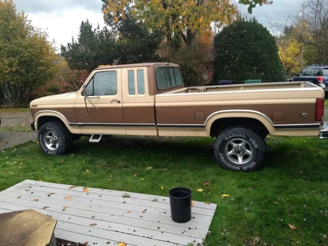 1986 two tone light and dark brown Ford F-250 Extended Cab Pickup