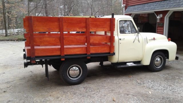 1954 cream Ford F-250 stake bed