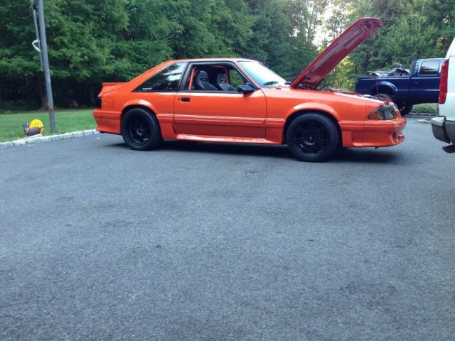 1989 Orange metallic Ford Mustang Hatchback