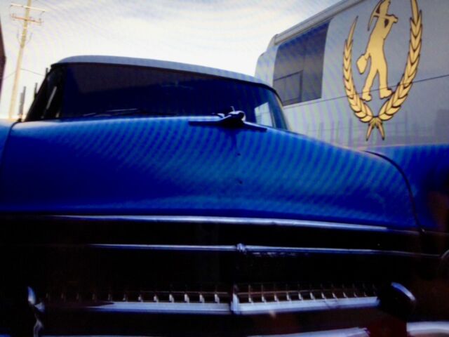 1955 Blue white Ford Mainline 4 dr