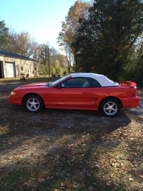 1994 red Ford Mustang Convertible