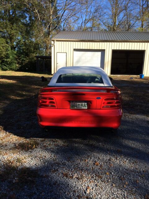 1994 red Ford Mustang Convertible
