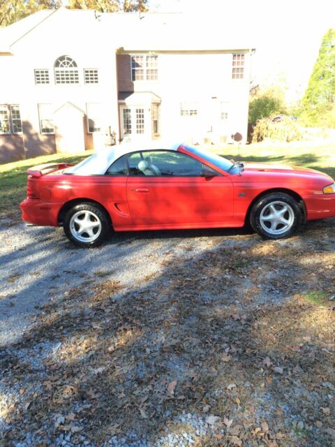 1994 red Ford Mustang Convertible