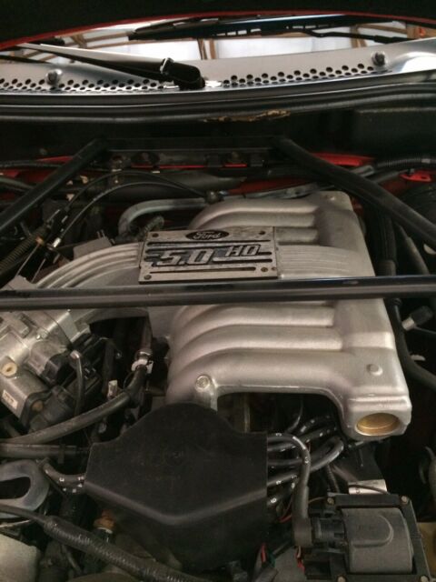 1994 red Ford Mustang Convertible