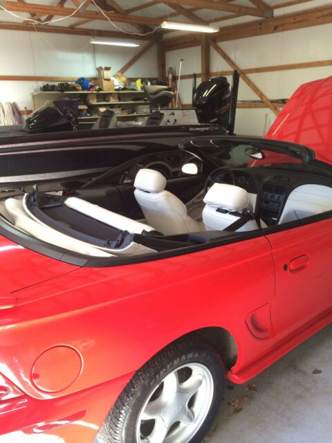 1994 red Ford Mustang Convertible