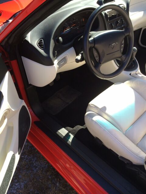 1994 red Ford Mustang Convertible