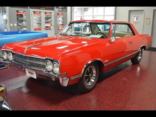 1965 Red Oldsmobile Cutlass Coupe