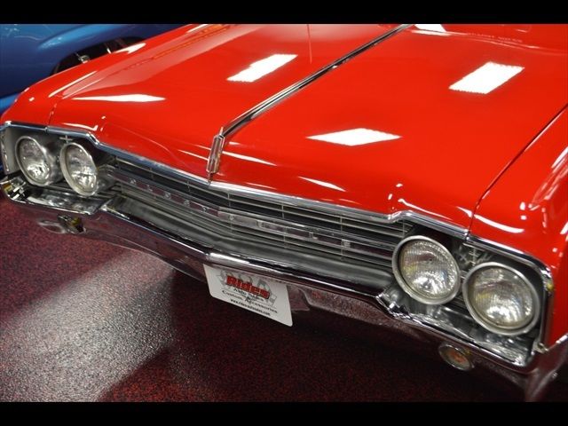 1965 Red Oldsmobile Cutlass Coupe