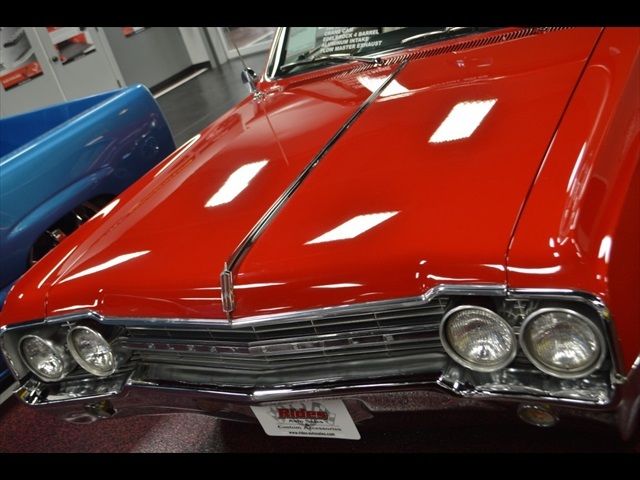 1965 Red Oldsmobile Cutlass Coupe
