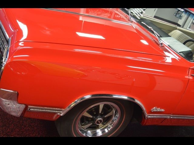 1965 Red Oldsmobile Cutlass Coupe