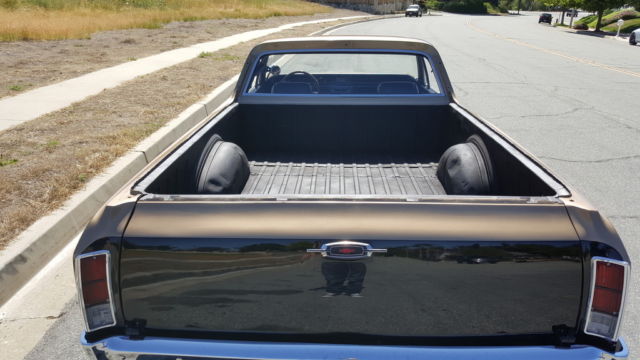 1966 black and gold Chevrolet El Camino