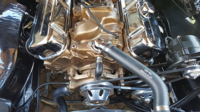 1966 black and gold Chevrolet El Camino