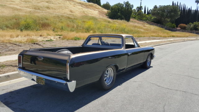 1966 black and gold Chevrolet El Camino