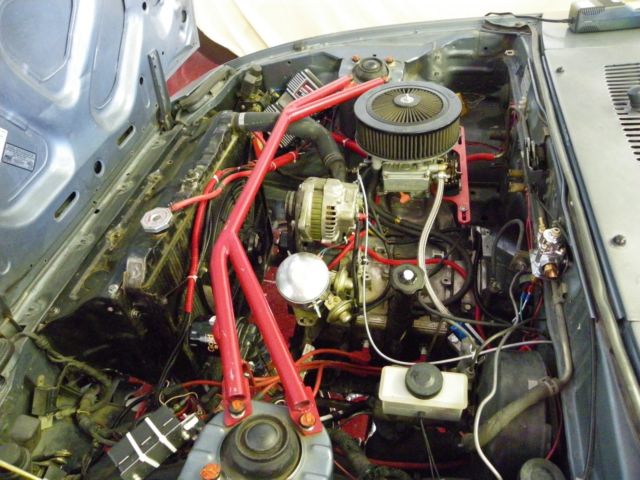 1985 gun metal gray Mazda RX-7 coupe