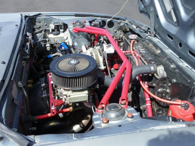 1985 gun metal gray Mazda RX-7 coupe