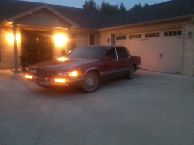 1991 Red Cadillac DeVille Sedan