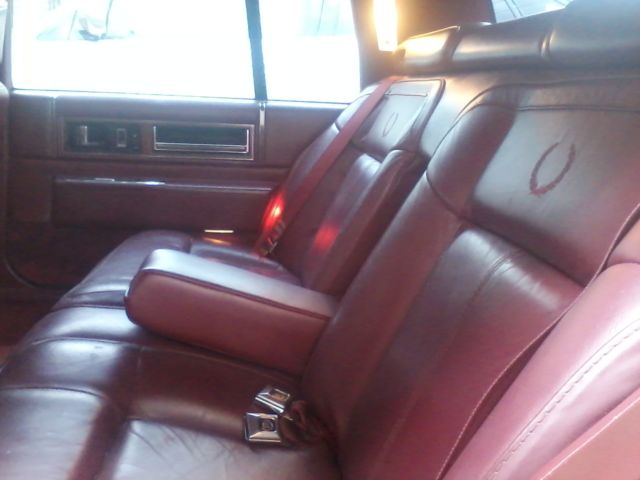 1991 Red Cadillac DeVille Sedan