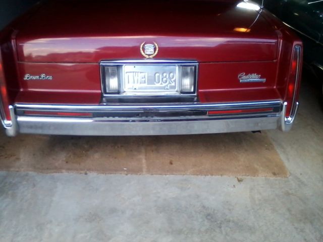 1991 Red Cadillac DeVille Sedan