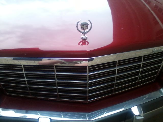 1991 Red Cadillac DeVille Sedan