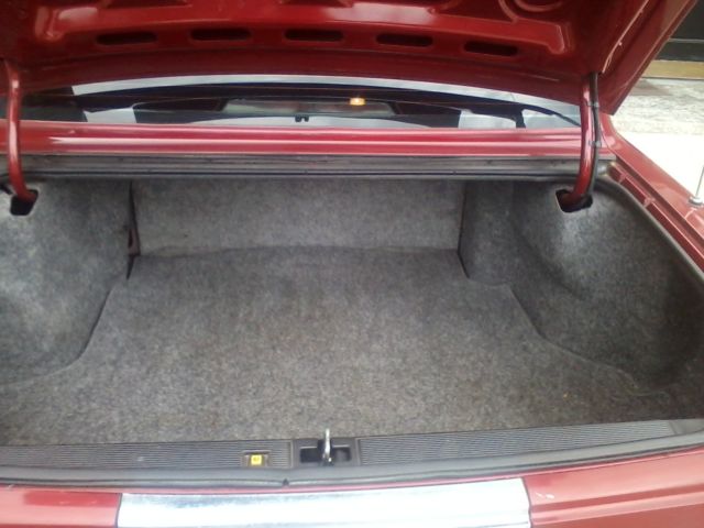 1991 Red Cadillac DeVille Sedan