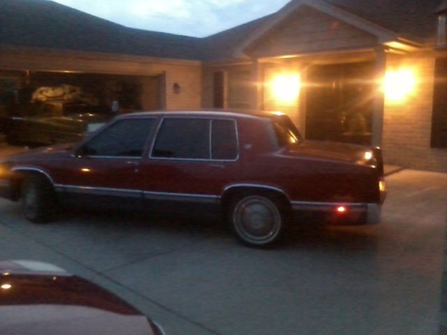 1991 Red Cadillac DeVille Sedan