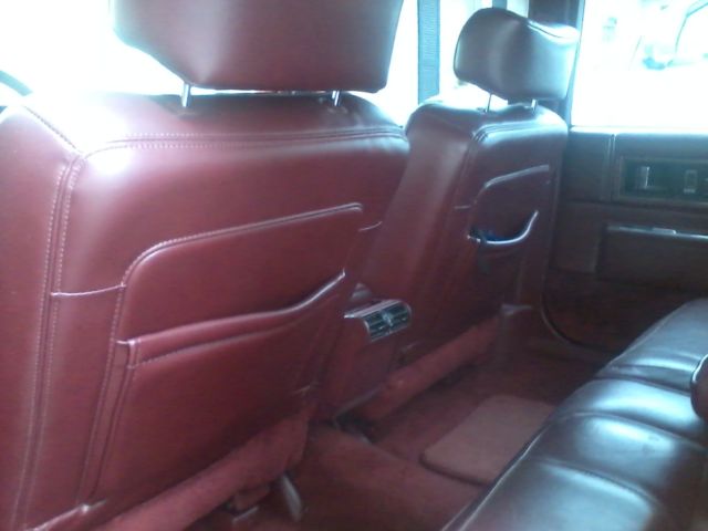 1991 Red Cadillac DeVille Sedan