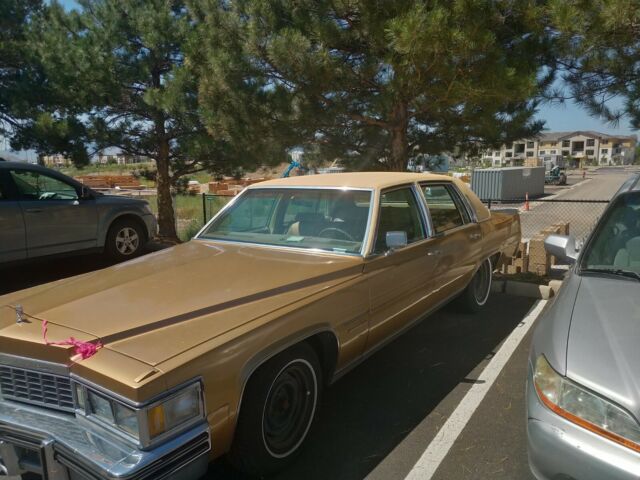 1977 Gold Cadillac Brougham Sedan
