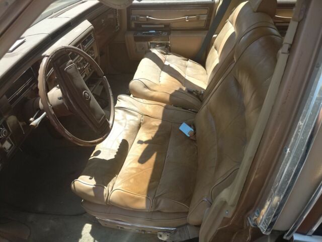 1977 Gold Cadillac Brougham Sedan