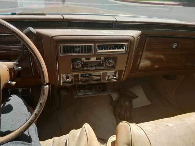 1977 Gold Cadillac Brougham Sedan