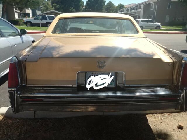 1977 Gold Cadillac Brougham Sedan