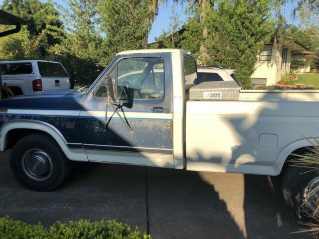 1986 blue and white Ford F-250