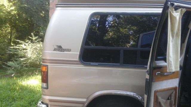 1992 Tan Ford E-Series Van Handicap Van