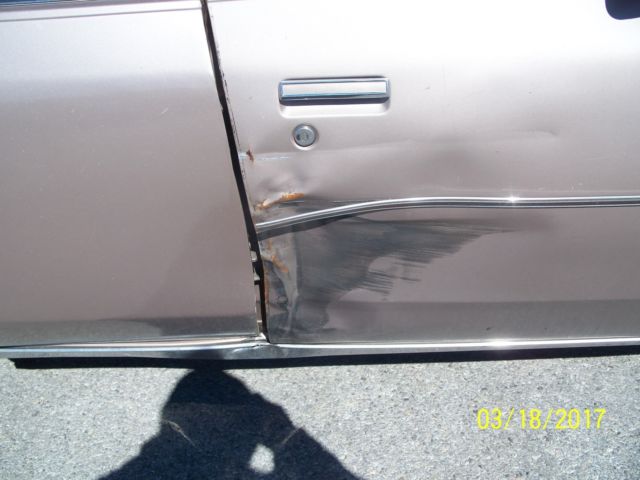 1984 lt.brown Oldsmobile Cutlass Sedan