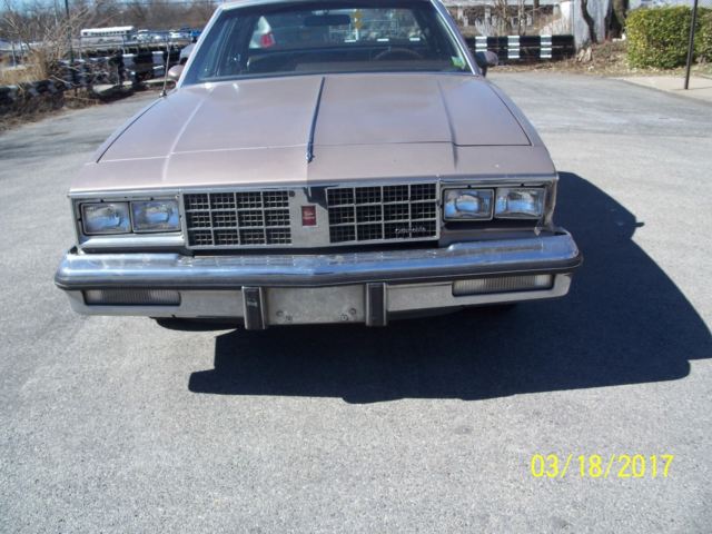 1984 lt.brown Oldsmobile Cutlass Sedan