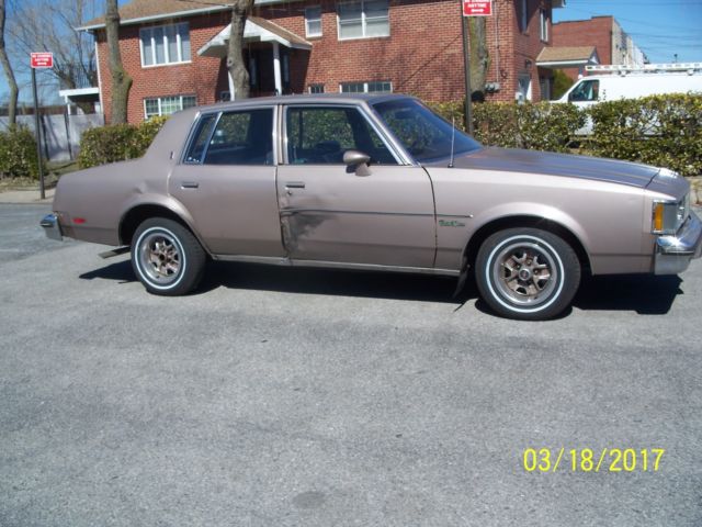 1984 lt.brown Oldsmobile Cutlass Sedan
