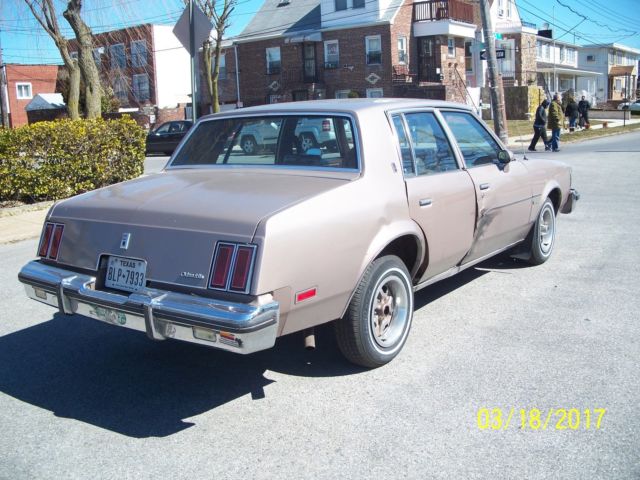 1984 lt.brown Oldsmobile Cutlass Sedan