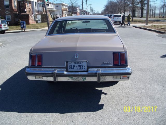 1984 lt.brown Oldsmobile Cutlass Sedan