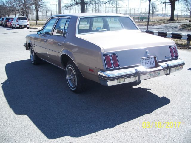 1984 lt.brown Oldsmobile Cutlass Sedan