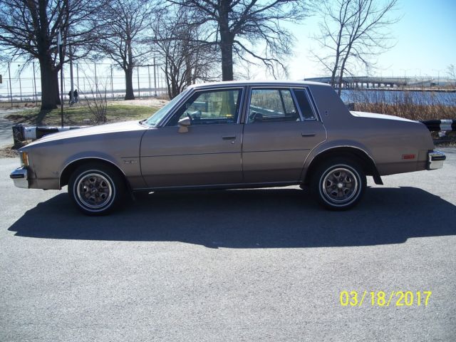 1984 lt.brown Oldsmobile Cutlass Sedan