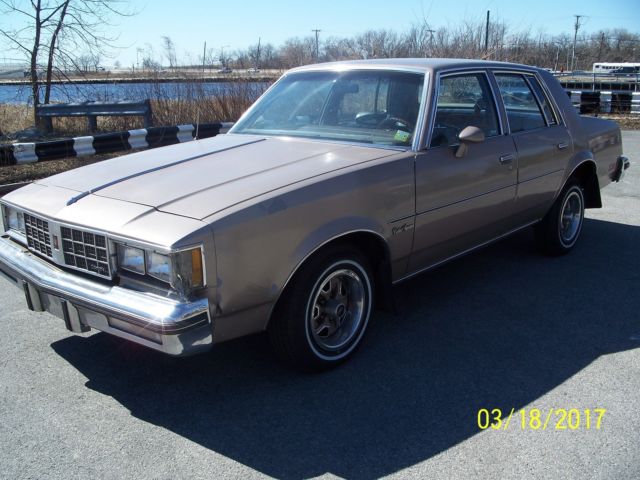 1984 lt.brown Oldsmobile Cutlass Sedan