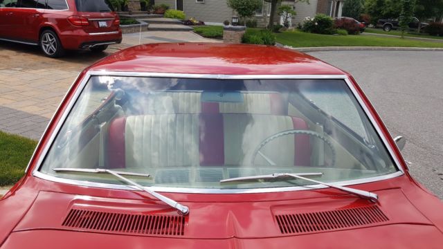 1965 Red Chevrolet Corvair Sedan